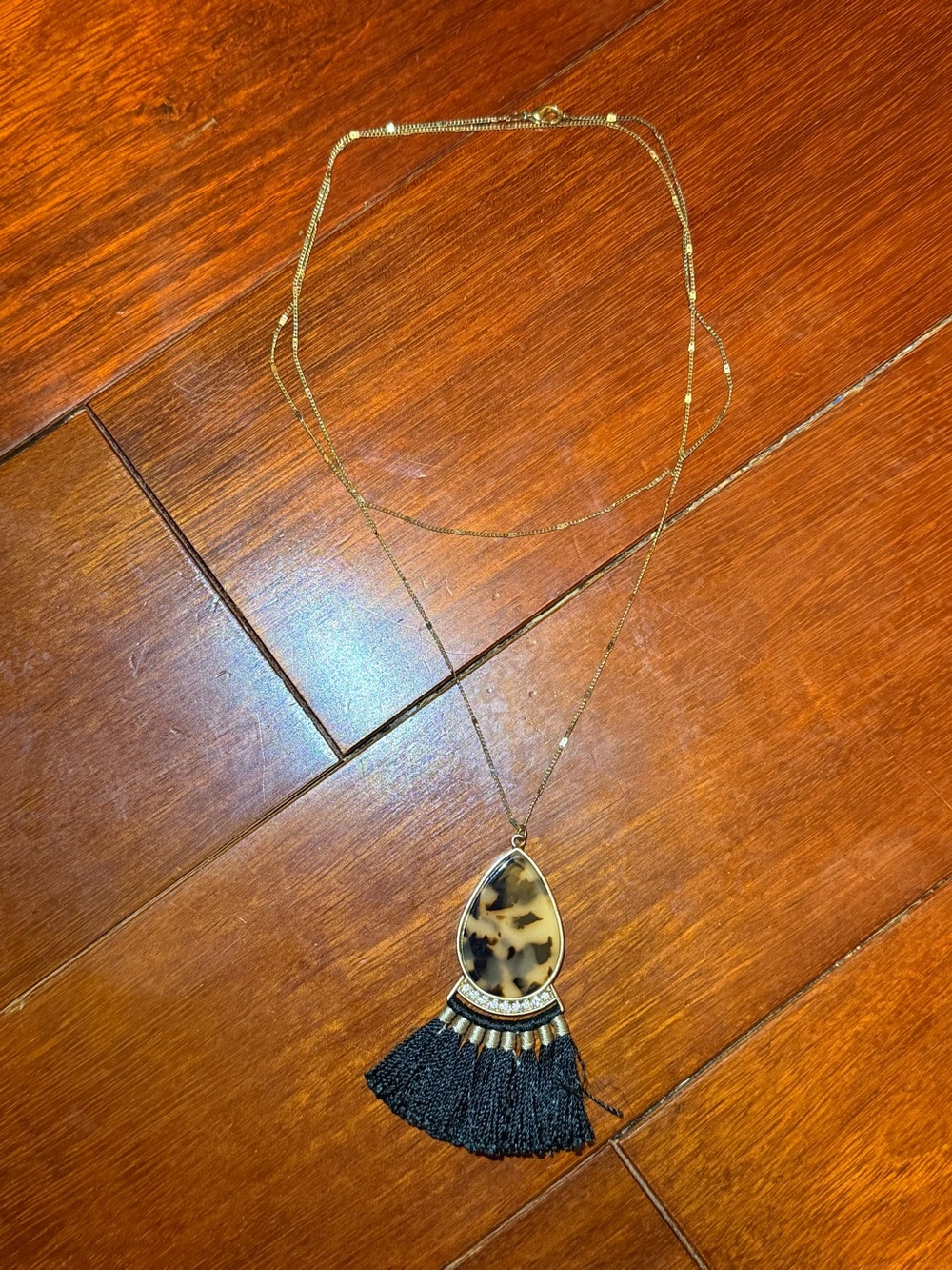Gold Layered Necklace with Tortoiseshell Teardrop and Black Tassel